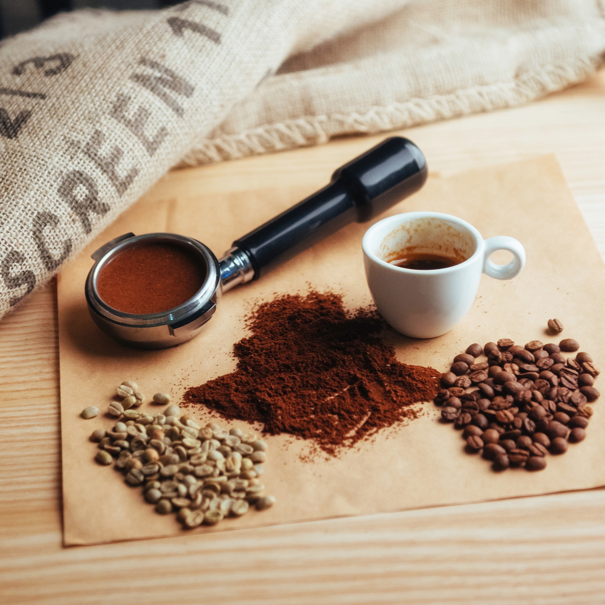Top view cup of coffee and three different varieties